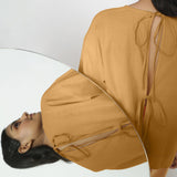 Back View of a Model wearing Vegetable-Dyed Orange 100% Cotton Straight Top