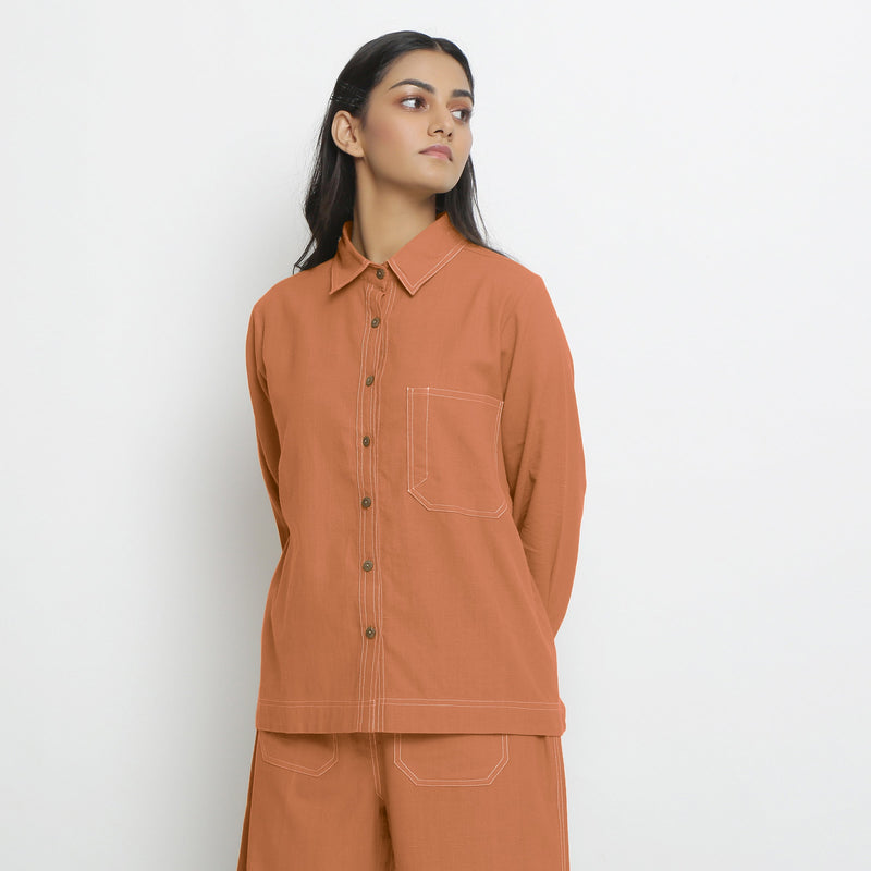 Front View of a Model wearing Vegetable Dyed Orange Button-Down Top