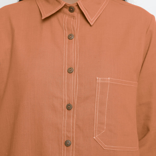 Front Detail of a Model wearing Vegetable Dyed Orange Button-Down Top