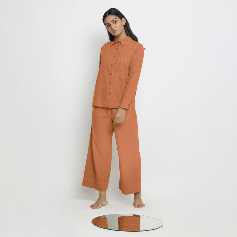 Front View of a Model wearing Vegetable Dyed Orange Button-Down Top