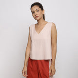 Front View of a Model wearing Pink Handspun Cotton Sleeveless Deep Neck Top