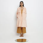Front View of a Model wearing Powder Pink Vegetable Dyed Handspun Cotton Notched Collar Front Open Overlay