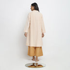 Back View of a Model wearing Powder Pink Vegetable Dyed Handspun Cotton Notched Collar Front Open Overlay