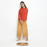 Front View of a Model wearing Vegetable-Dyed Red 100% Cotton Straight Top