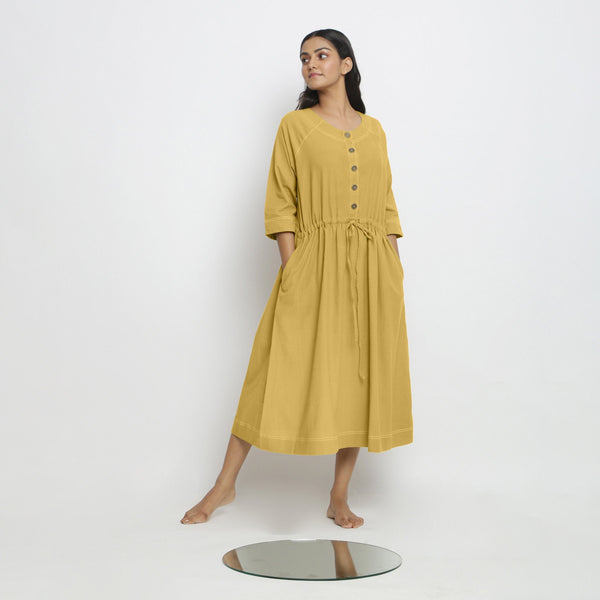 Front View of a Model wearing Vegetable-Dyed Yellow 100% Cotton Button-Down Dress