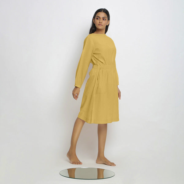 Right View of a Model wearing Vegetable-Dyed Yellow 100% Cotton Dress