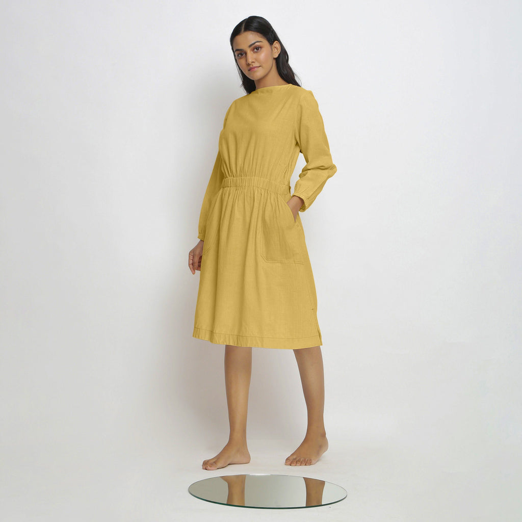 Left View of a Model wearing Vegetable-Dyed Yellow 100% Cotton Dress