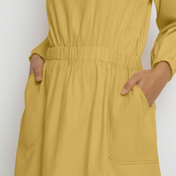 Front Detail of a Model wearing Vegetable-Dyed Yellow 100% Cotton Dress