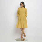 Front View of a Model wearing Vegetable-Dyed Yellow 100% Cotton Dress