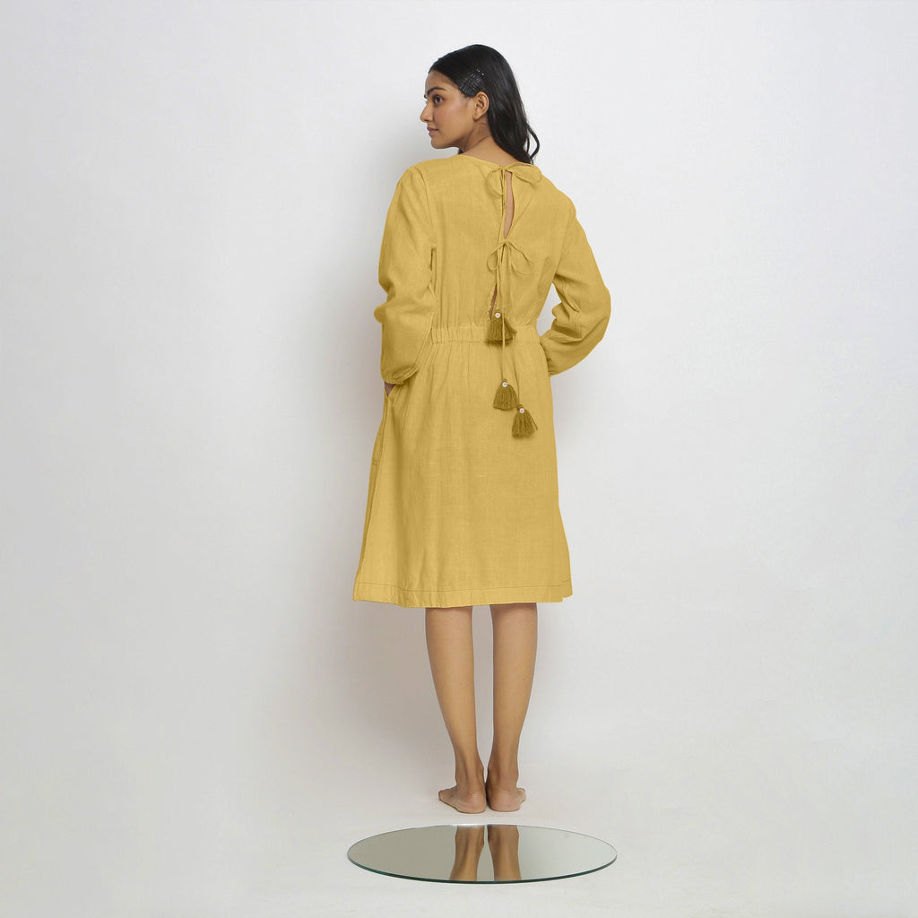 Back View of a Model wearing Vegetable-Dyed Yellow 100% Cotton Dress