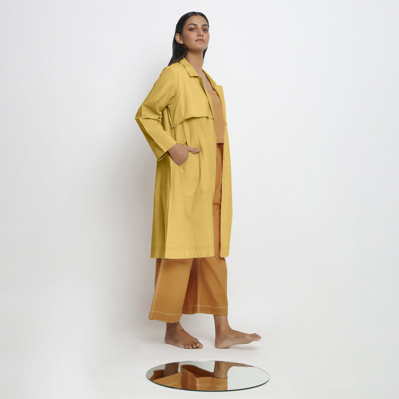 Right View of a Model wearing Vegetable-Dyed Yellow 100% Cotton Paneled Overlay