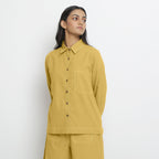 Front View of a Model wearing Vegetable Dyed Yellow Button-Down Cotton Top