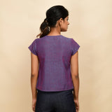 Back View of a Model wearing Violet Handspun Cotton Round Neck Asymmetrical Crop Top