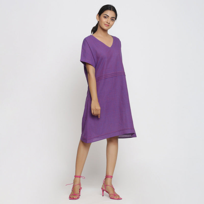 Right View of a Model wearing Violet Cotton V-Neck Pleated Dress