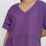 Front Detail of a Model wearing Violet Cotton V-Neck Pleated Dress