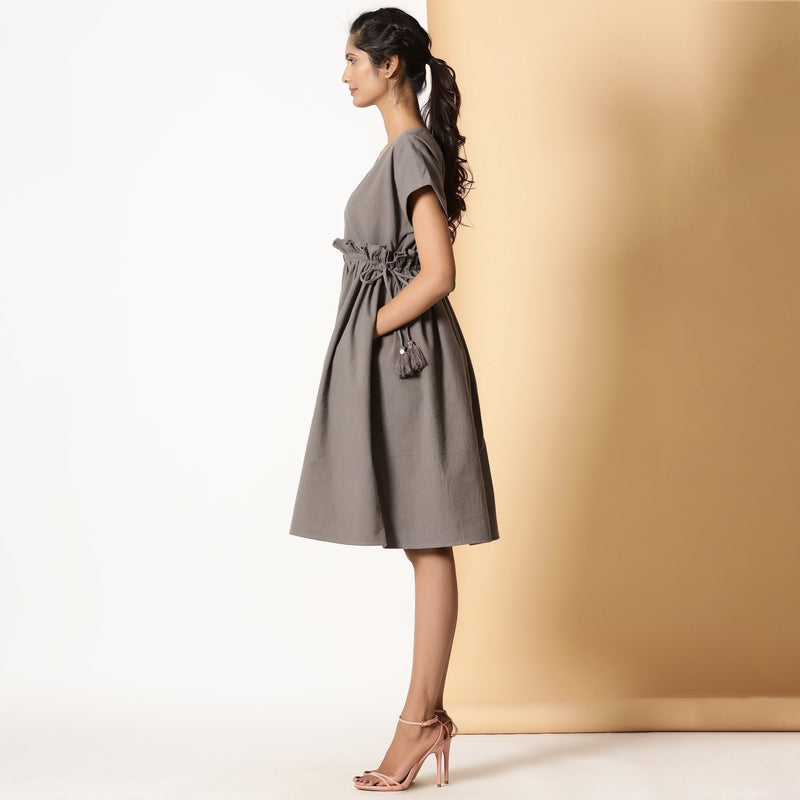 Left View of a Model wearing Ash Grey Warm Cotton Flannel Knee Length Frilled Dress