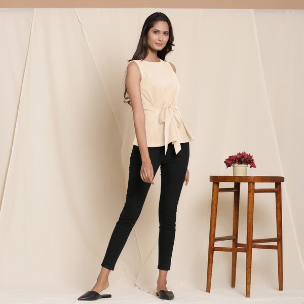 Right View of a Model wearing Warm Beige A-Line Cotton Top