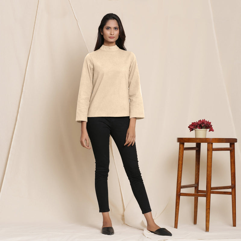 Front View of a Model wearing Warm Beige Turtle Neck Straight Top