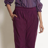 Front Detail of a Model wearing Solid Berry Wine Warm Cotton Tapered Pant