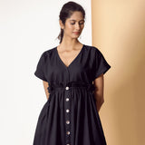 Front View of a Model wearing Black Warm Cotton Flannel Knee Length Frilled Dress