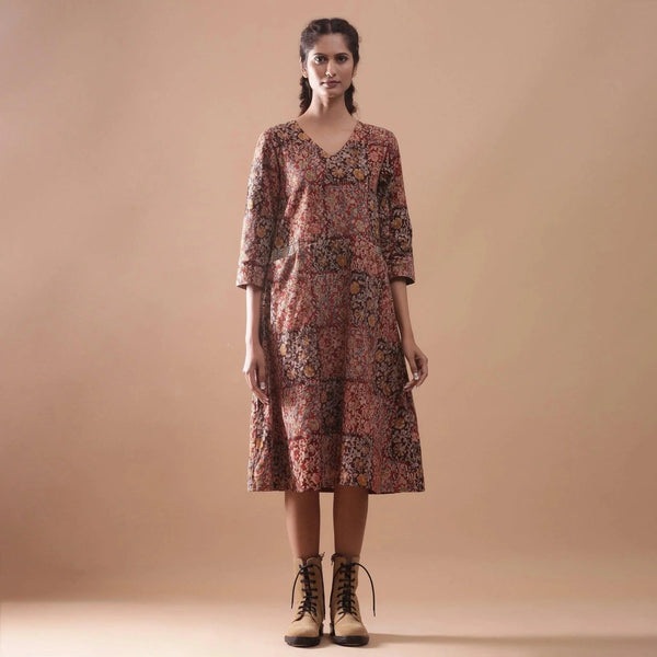 Front View of a Model wearing Warm Block Printed Muddy Red Cotton Midi Dress