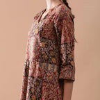 Left Detail of a Model wearing Warm Block Printed Muddy Red Cotton Midi Dress