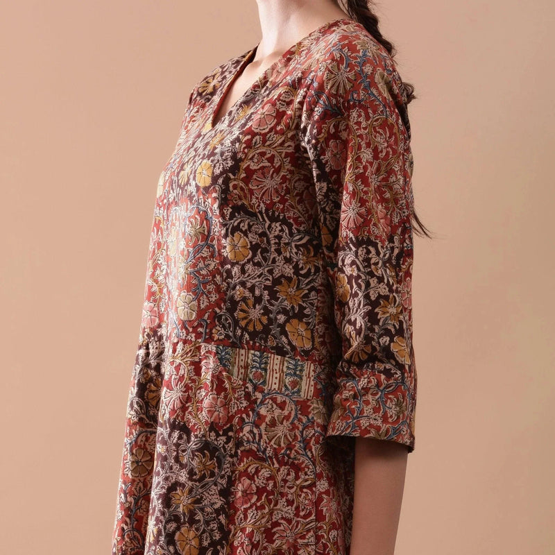 Left Detail of a Model wearing Warm Block Printed Muddy Red Cotton Midi Dress