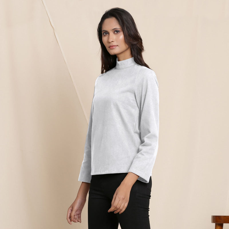 Left View of a Model wearing Warm Cloudy Grey Turtleneck Straight Top