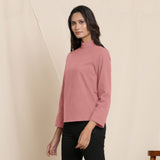 Left View of a Model wearing Warm English Rose Turtleneck Straight Top