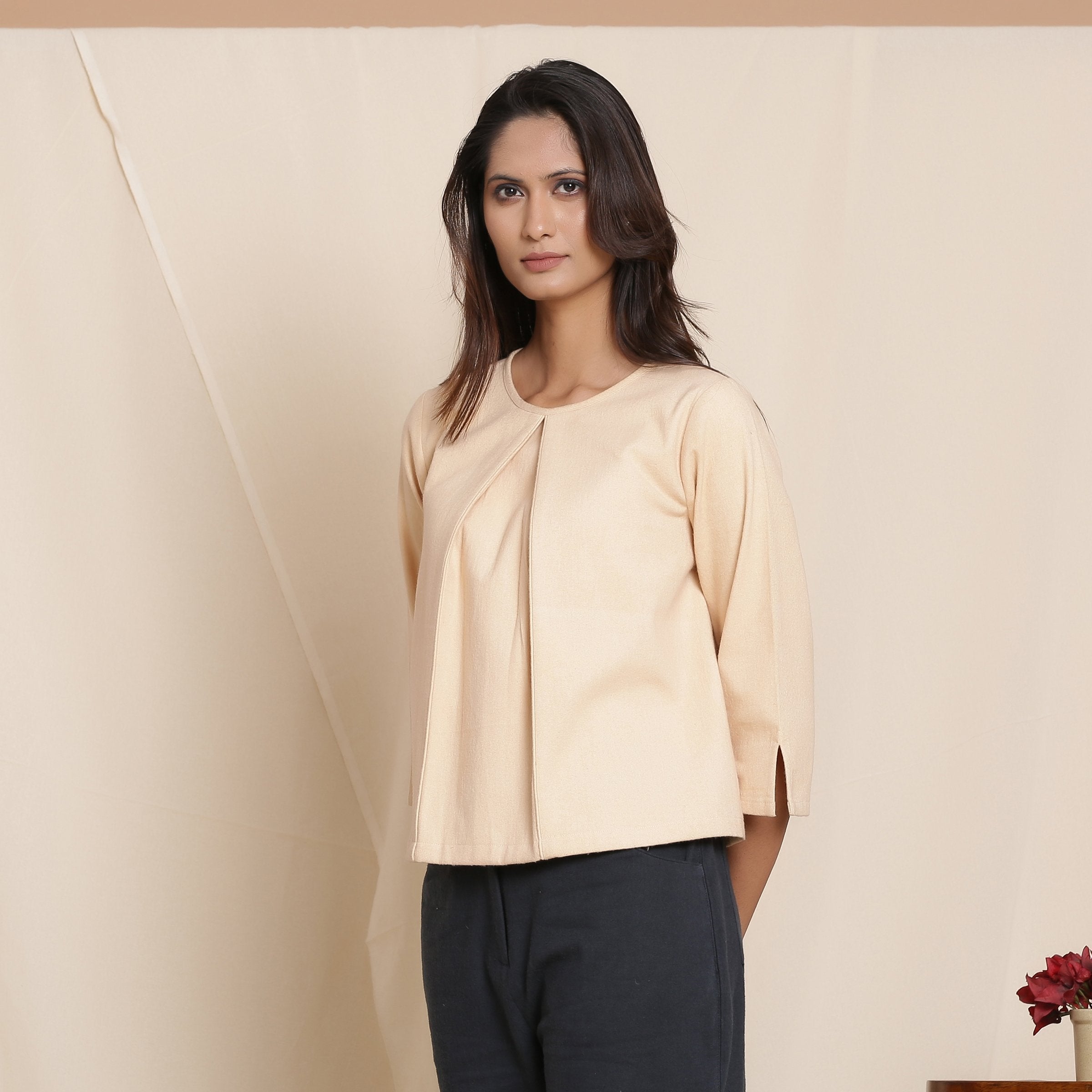Left View of a Model wearing Dusk Beige Warm Cotton Flannel Box-Pleat Top