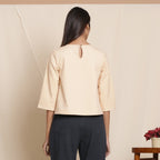 Back View of a Model wearing Dusk Beige Warm Cotton Flannel Box-Pleat Top