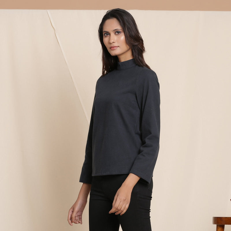 Left View of a Model wearing Moonlight Black Warm Cotton Flannel High Neck Top