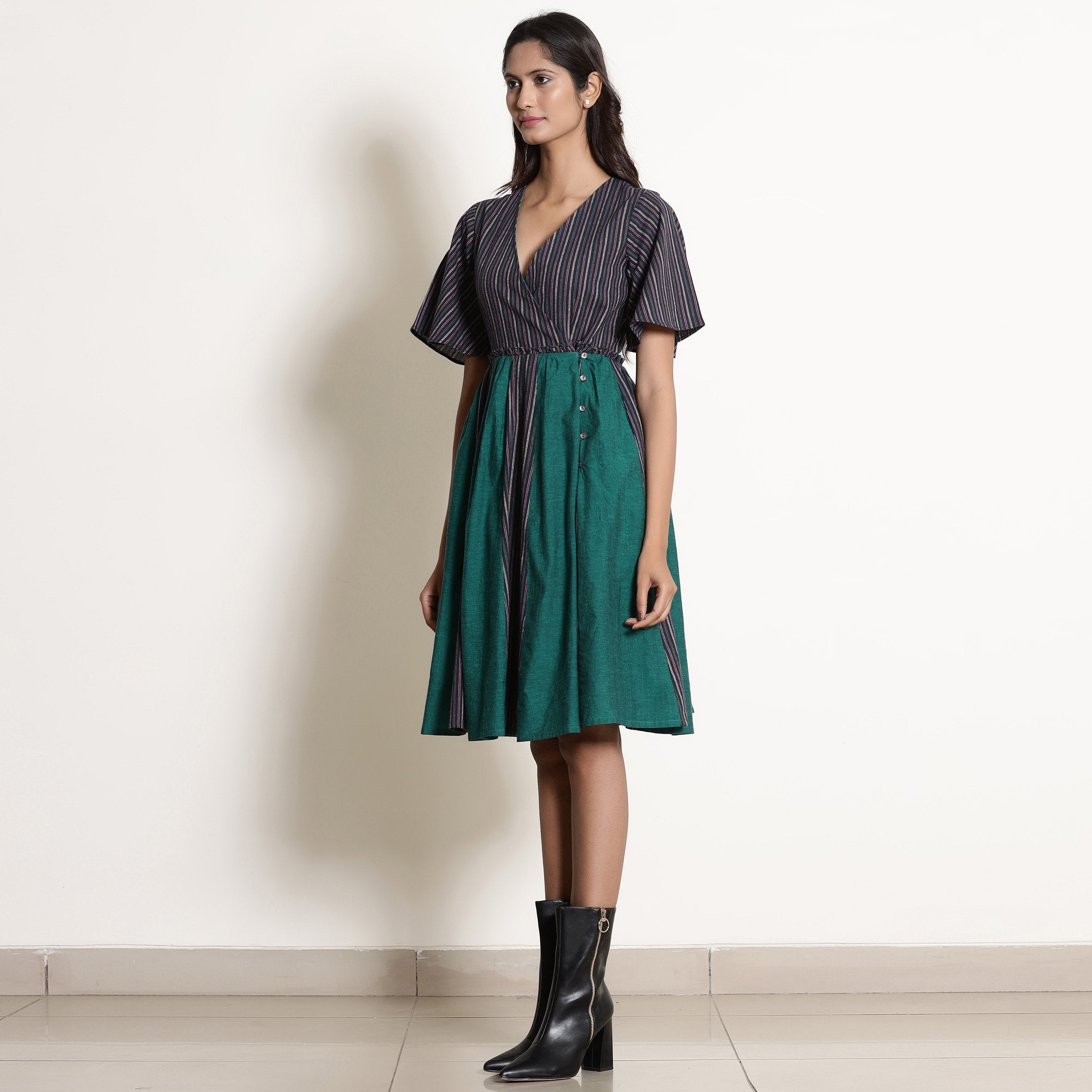 Left View of a Model wearing Warm Cotton Striped Knee Length Wrap Dress