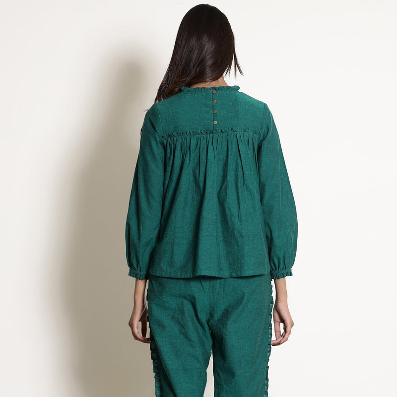 Back View of a Model wearing Green Warm Cotton Frilled Gathered Yoke Top