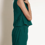 Right Detail of a Model wearing Warm Pine Green V-Neck Flared Top
