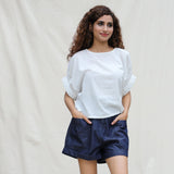 Front View of a Model wearing White 100% Cotton Hand-Beaded Drop Shoulder Button-Down Shirt