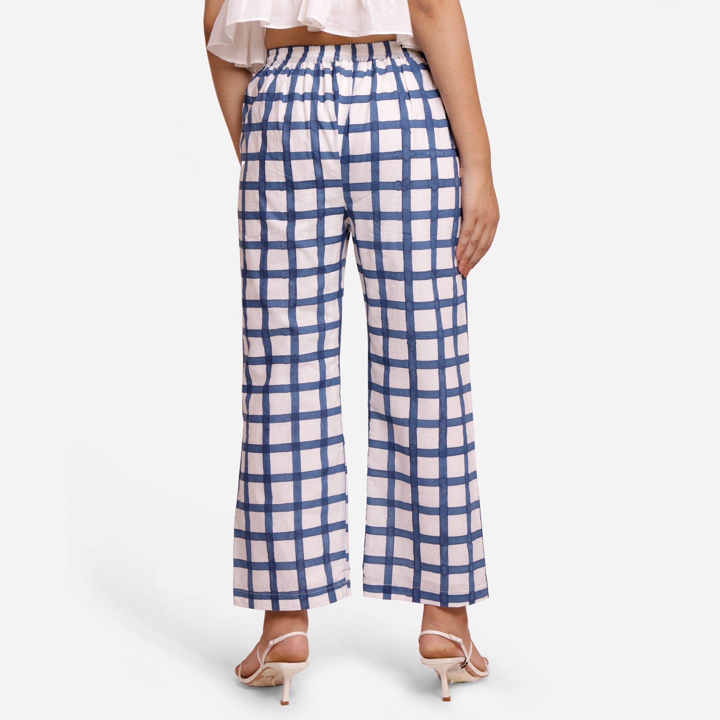 Back View of a Model wearing White and Blue Checks Block Print Ankle Length Cotton Pant