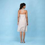 Back View of a Model wearing White Block Printed Cotton Knee Length Dress