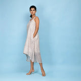 Left View of a Model wearing White Block Printed High-Low Cotton Midi Dress