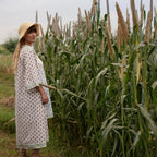 Right View of a Model wearing White Block Printed Straight Shrug