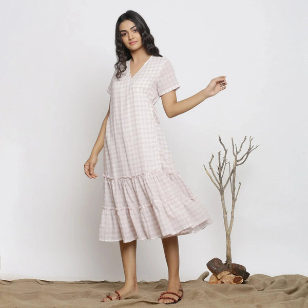 Left View of a Model wearing White Checks Handspun Cotton Muslin Midi Wrap Dress