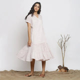 Left View of a Model wearing White Checks Handspun Cotton Muslin Midi Wrap Dress