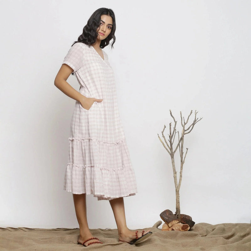 Right View of a Model wearing White Checks Handspun Cotton Muslin Midi Wrap Dress