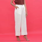 Right View of a Model wearing White Corduroy Hand Beaded Bootcut Pant