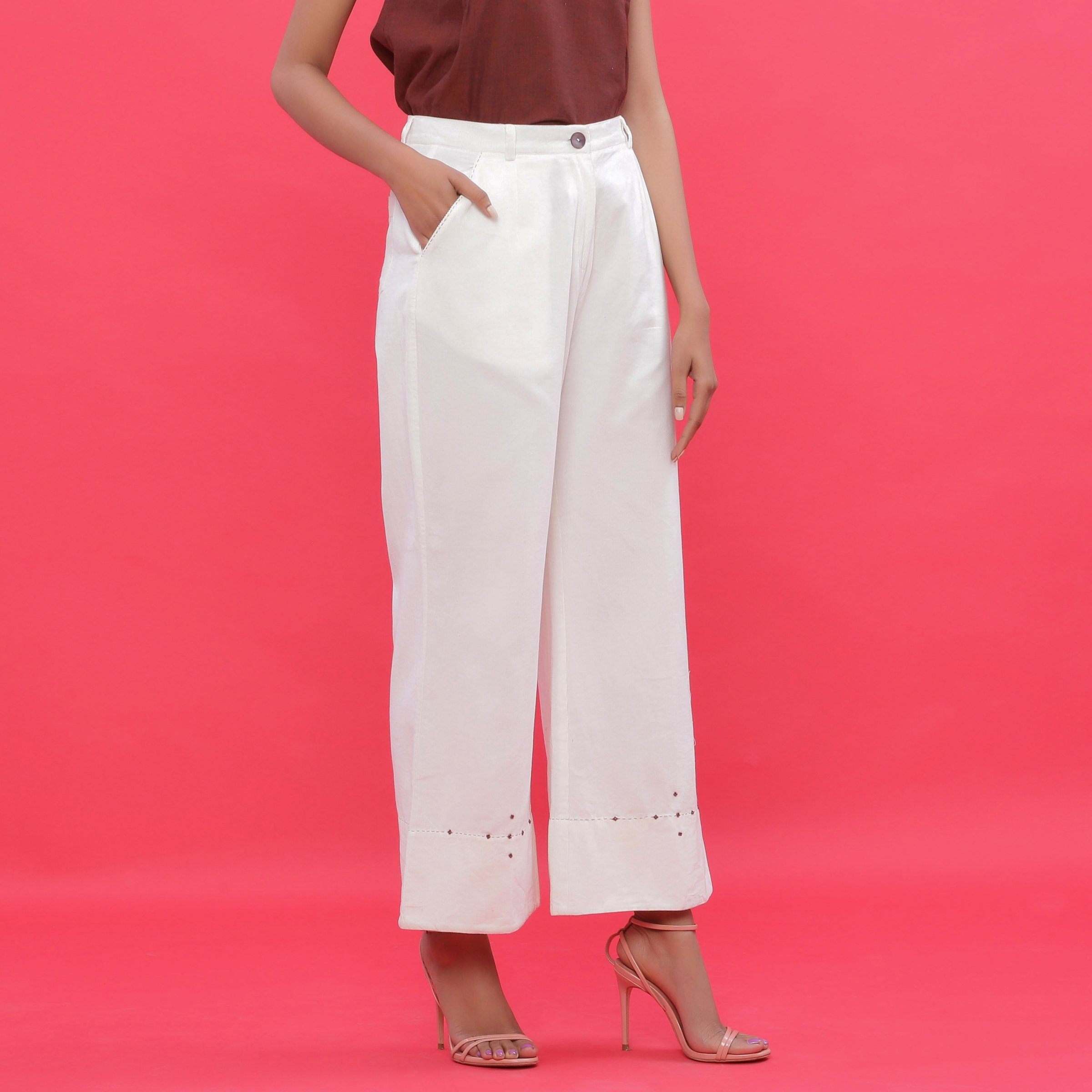 Right View of a Model wearing White Corduroy Hand Beaded Bootcut Pant