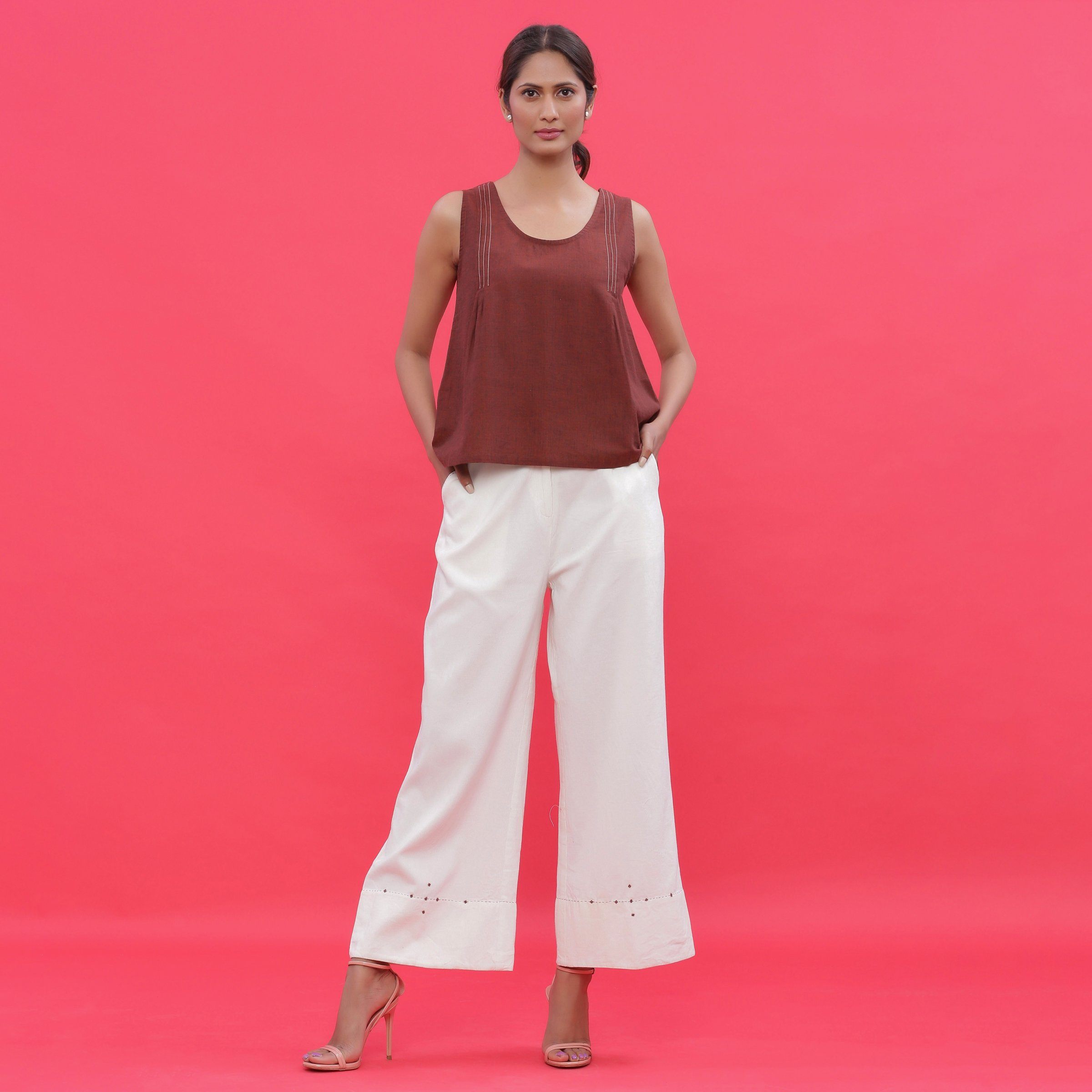 Front View of a Model wearing White Corduroy Hand Beaded Bootcut Pant