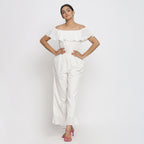 Front View of a Model wearing White Warm Cotton Corduroy Frilled Ankle Length Jumpsuit