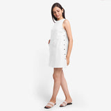 Left View of a Model wearing White Cotton Flax Kangaroo Pocket Dress