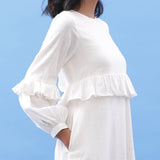 Right Detail of a Model wearing White Cotton Frilled Bohemian Tier Midi Dress