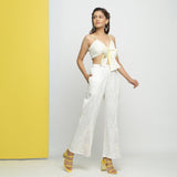 Right View of a Model wearing White Embroidered Cotton Lace Mid-Rise Paneled Pant